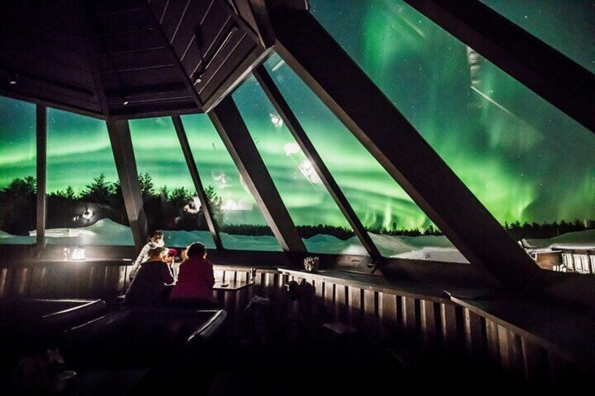 The Skybar where you can enjoy cocktail in the warmth with a panoramic view on the sky to wait for Northern Lights