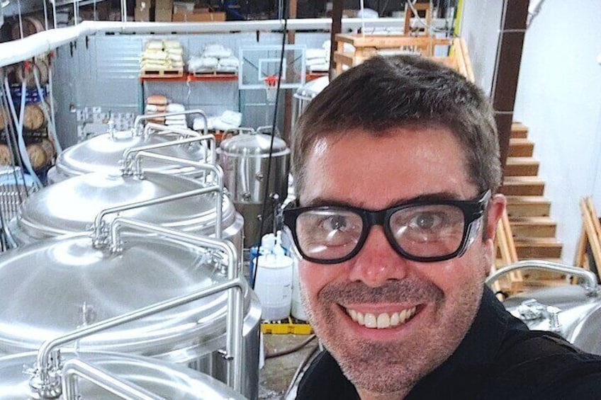 Rich among the brewery tanks at Mountains Walking Brewery