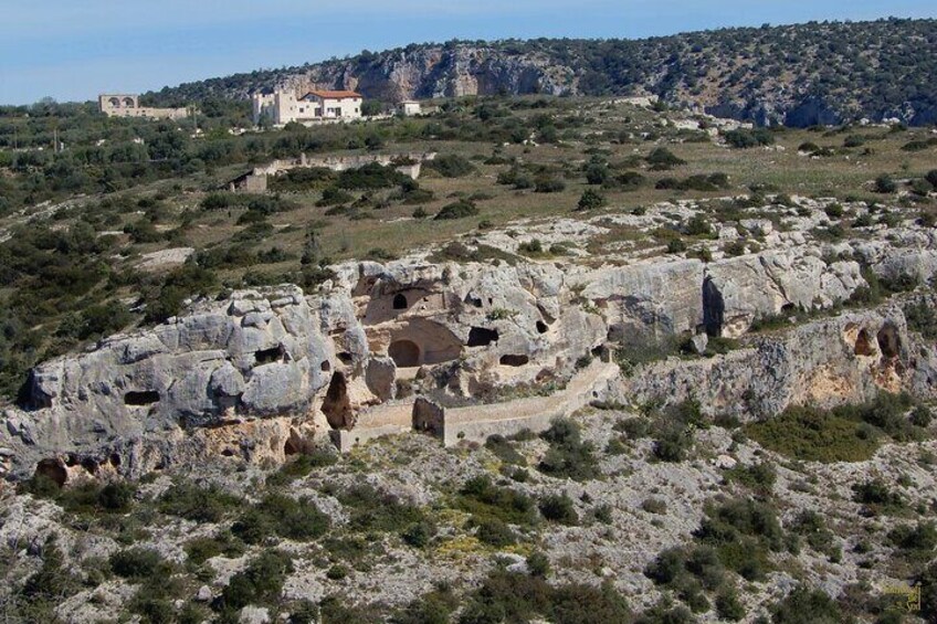 The rock church of San Nicola all'Ofra seen from afar.
