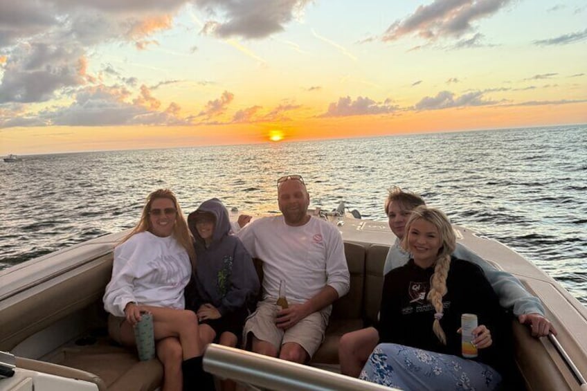 Family picture of sunset on a Sunset tour at anna maria island. 