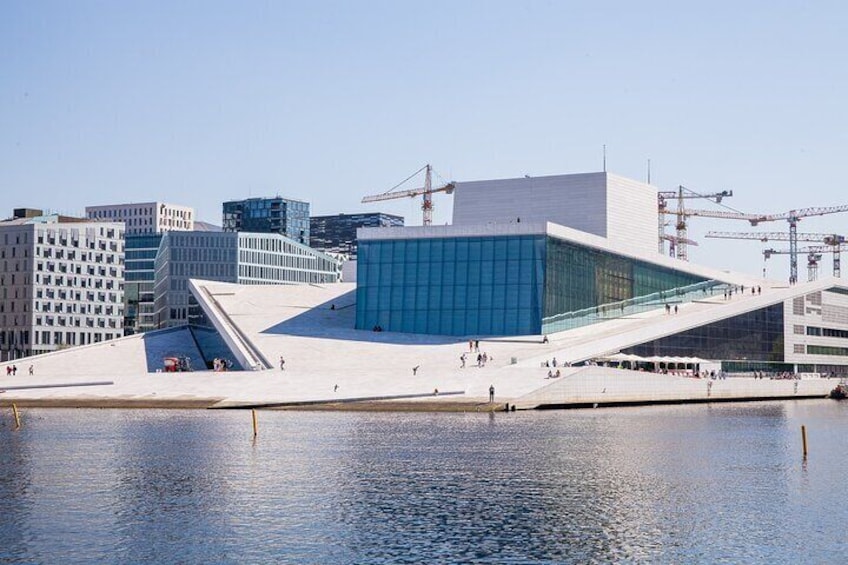 Drawing inspiration from icebergs, the Opera House invites visitors to ascend to its rooftop.