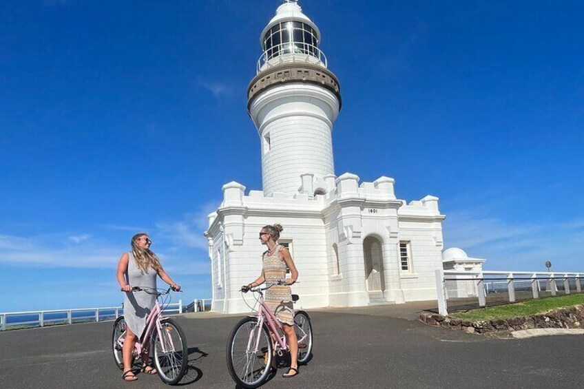 laura and marie at the Byron Bay lighthouse with their pink bikes