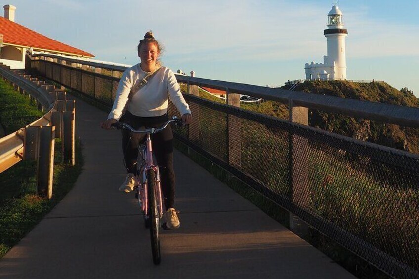 ridding down the footpath from the Byron Bay Lighthouse