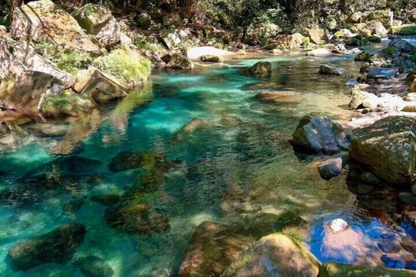 clean river water beside walking road, About 1 km.