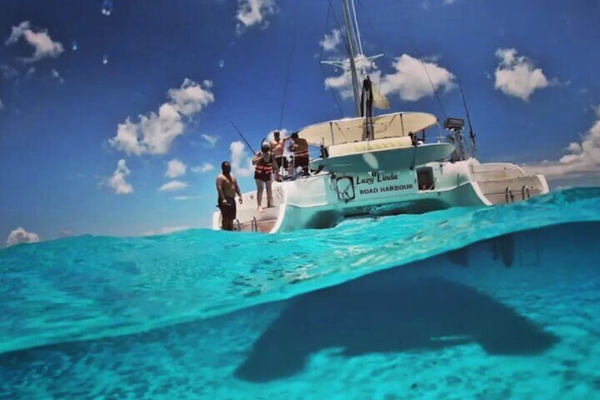 Experience luxury on the Lazy Linda, a 46 ft catamaran, perfect for snorkeling and relaxation in Riviera Maya