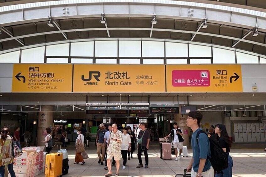 Meeting point . When you reach Nippori Station , go to North Gate , then go out to West Exit (for Yanaka) 