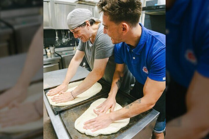 Rolling out the focaccia dough