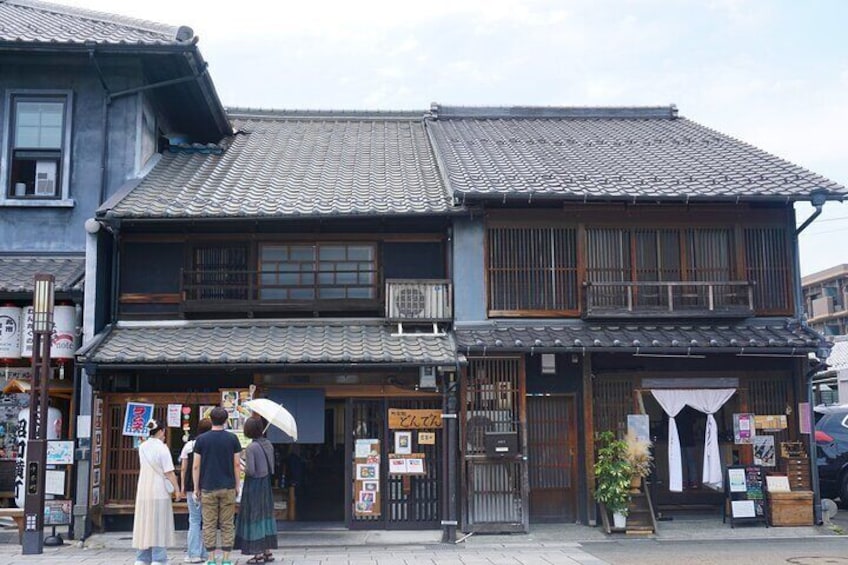 In this street, many old buildings have been renovated and transformed into new, charming shops.