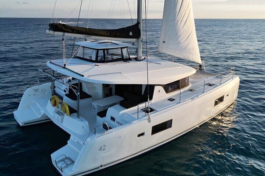 Lagoon 42 ft Catamaran at Anchor: Enjoy your luxurious day aboard the Lagoon 42 ft Catamaran, perfectly anchored for an idyllic escape on the water