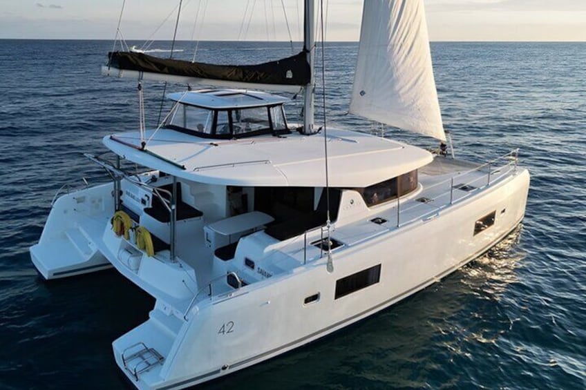 Lagoon 42 ft Catamaran at Anchor: Enjoy your luxurious day aboard the Lagoon 42 ft Catamaran, perfectly anchored for an idyllic escape on the water