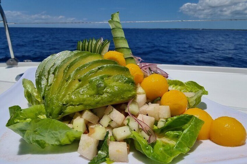 Fresh Tropical Vegan Ceviche: Indulge in a refreshing tropical salad and a colorful assortment of seasonal fruits, all prepared fresh for your enjoyment