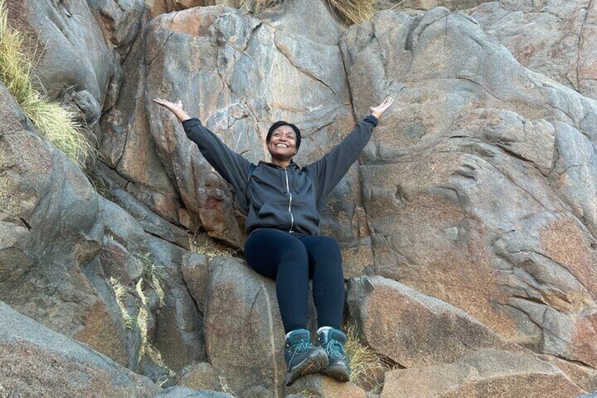 Tour participant enjoying the top of the mountain