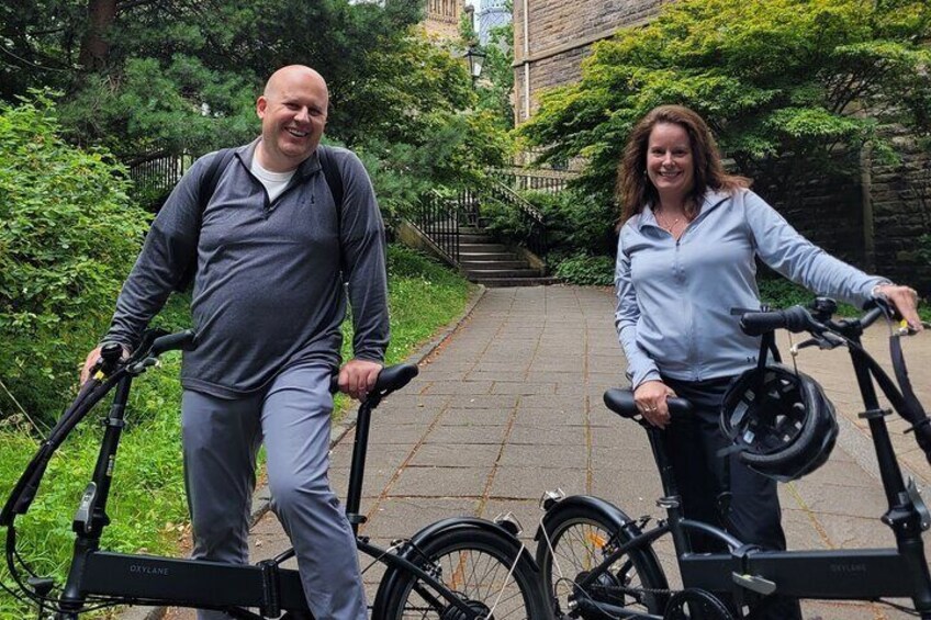 Glasgow ebike Tour Guests enjoying a photo opportunity stop at the beautiful University of Glasgow