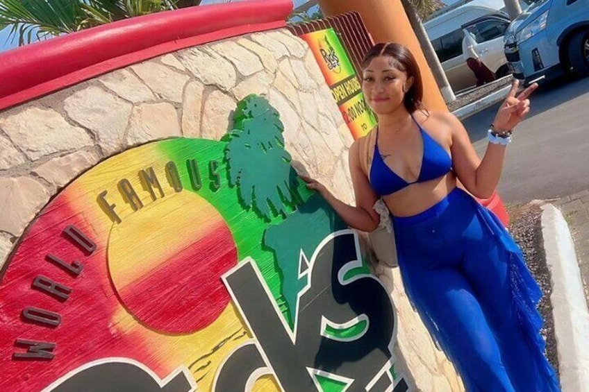 Guest enjoying her experience at Rick's Cafe