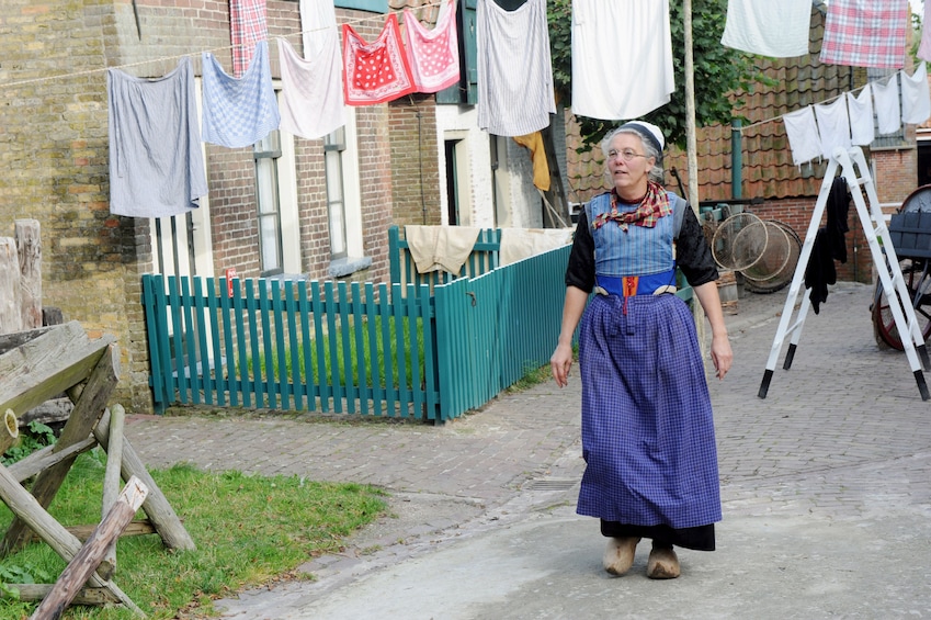 Woman walking down the road at Zuiderzeemuseum