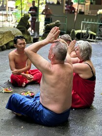 Balinese Purification at holy water temple with Local