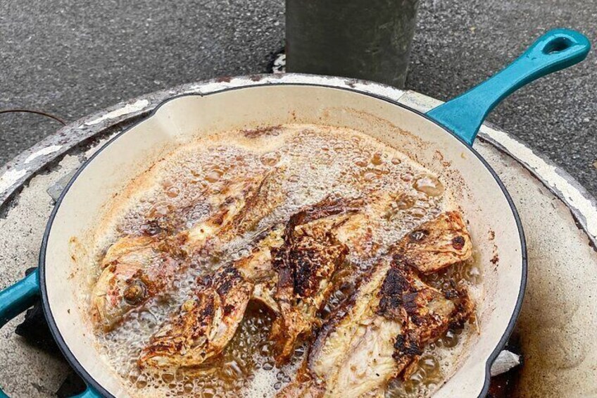 Cooking Fried Fish on the traditional stove