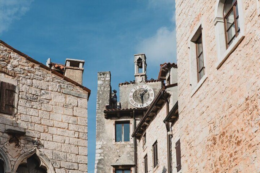 A medieval tower with a clock