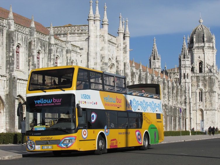 Hop-on hop-off bus in front of the Jerónimos Monastery in Lisbon
