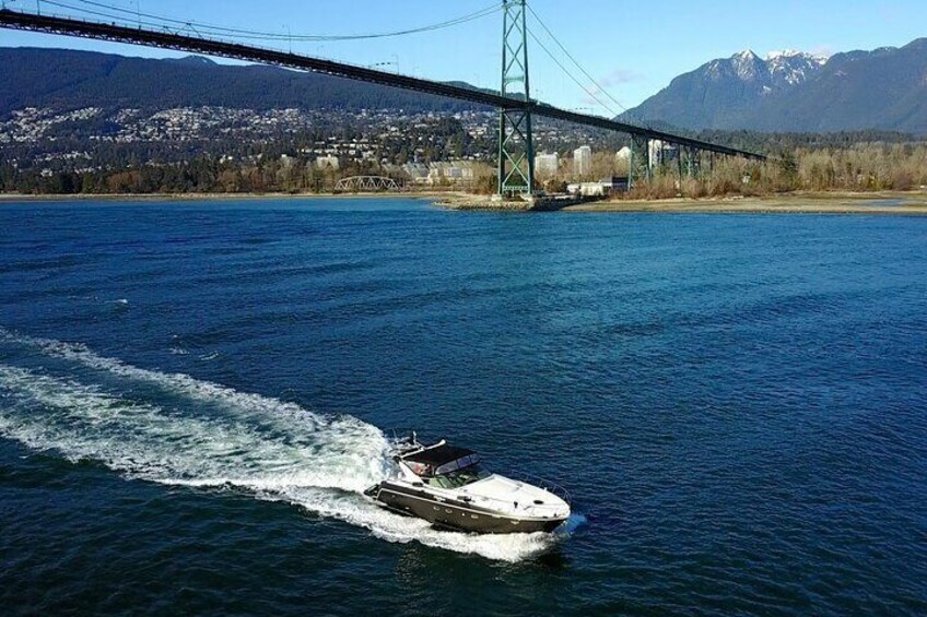 Vancouver sightseeing boat tour. The iconic Lions Gate bridge in the background.