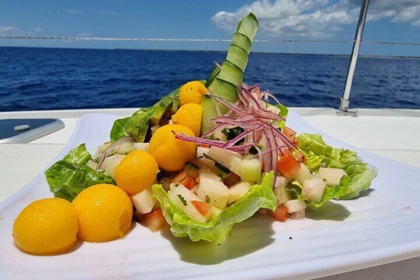 Savor a delicious shrimp ceviche, perfectly complemented by fresh fruits and veggies