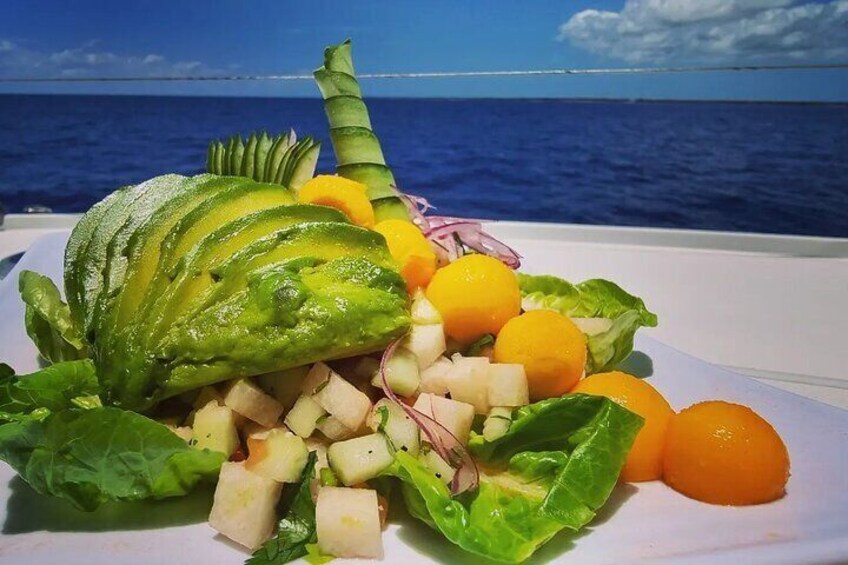 Enjoy a refreshing vegan ceviche made with seasonal tropical fruits, served with a view of the open sea