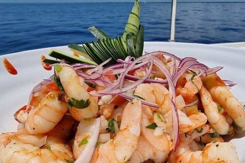 Indulge in a gourmet seafood platter prepared fresh on board