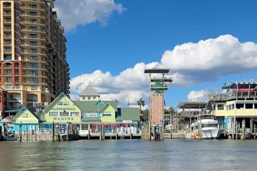 The Destin Boardwalk looks beautiful from the harbor.