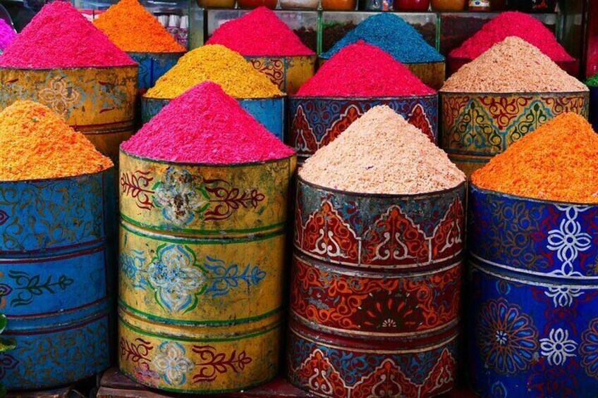 A vibrant display of Moroccan spices, capturing the rich colors and aromas that define the soul of Morocco's culinary heritage. 

