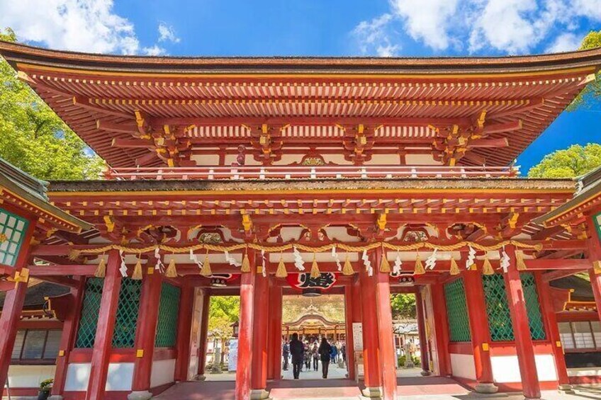Dazaifu Tenmangu Shrine features natural monument trees and seasonal blooms like plum blossoms and irises, with plum blossoms being Michizane's favorite.