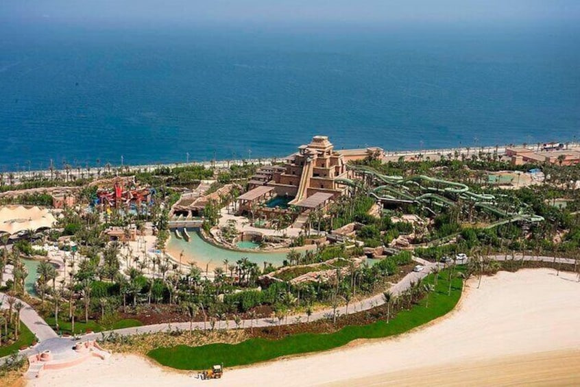 Discover a bird's-eye view of Aquaventure Waterpark, nestled on the shores of Dubai, offering endless water adventures for all ages.