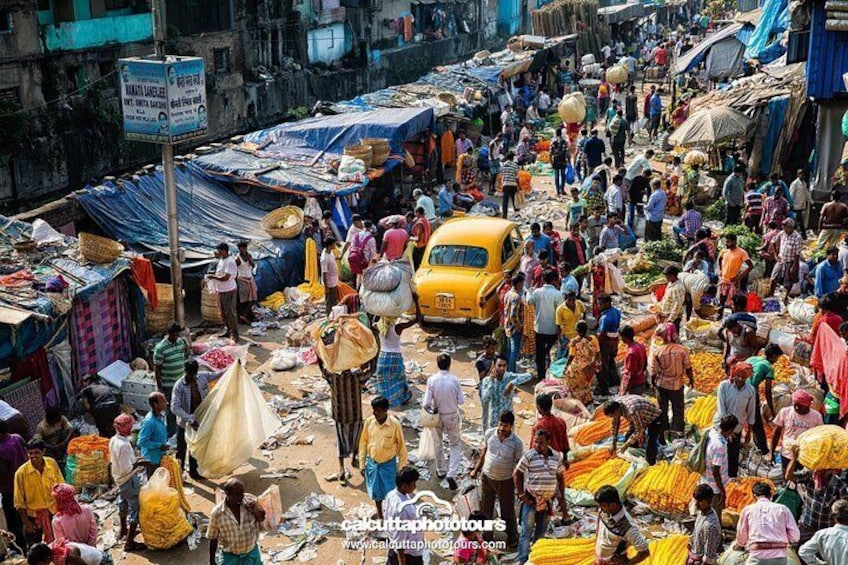 Walk around the largest flower market in India. And amongst the largest in Asia.