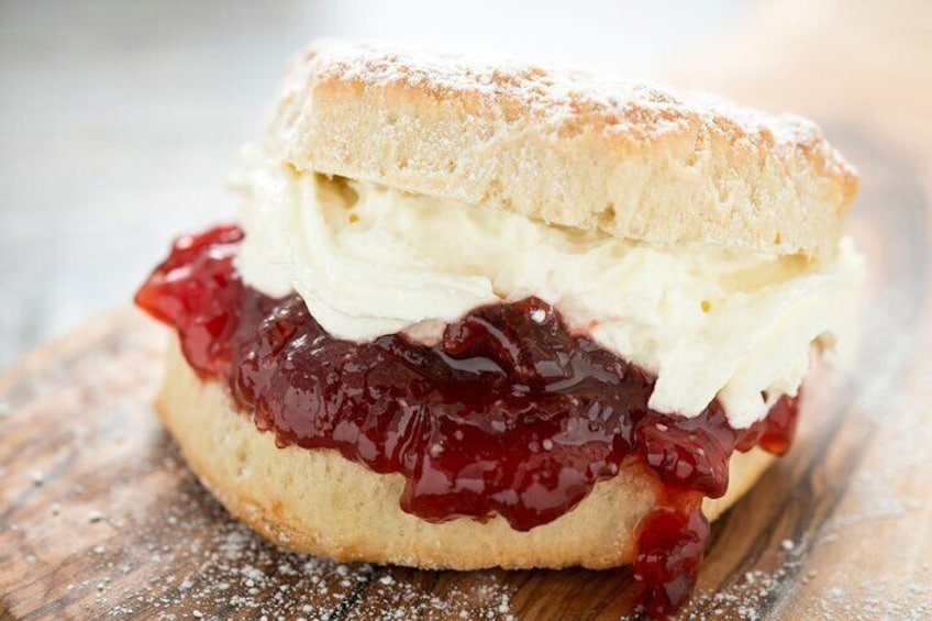 Enjoy fresh scones paired with jam and authentic cream