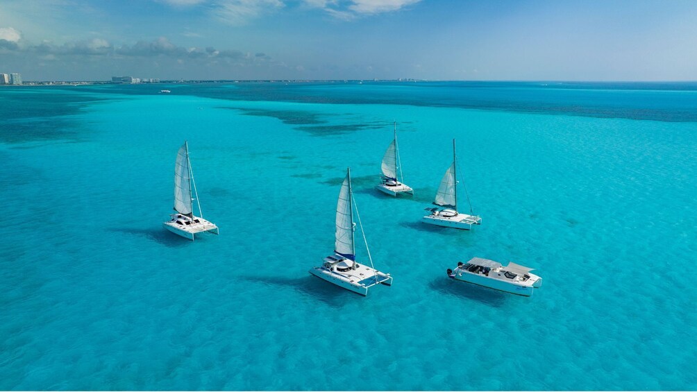 8 Hour Shared Catamaran to Isla Mujeres with Snorkeling, Food & Open Bar