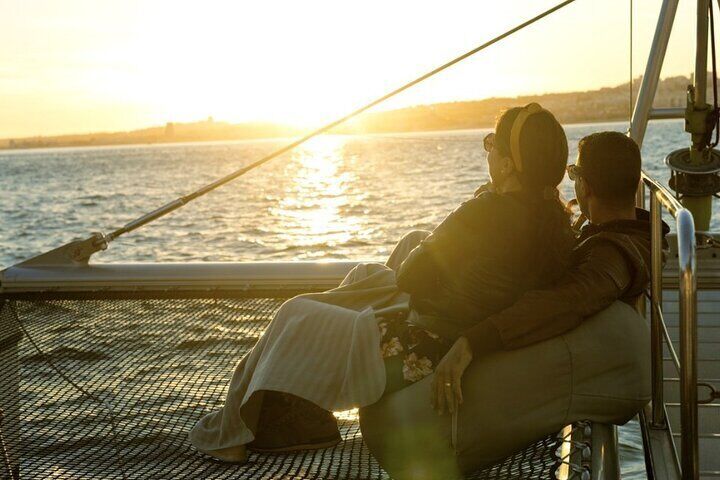 Sunset Experience: Lisbon Boat Cruise with Music and a Drink