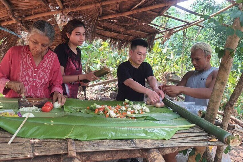 Trying to prepare cook inside bamboo tube.