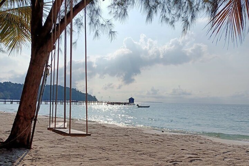 Sihanoukville Serene Beach with Wooden Swing and Boat