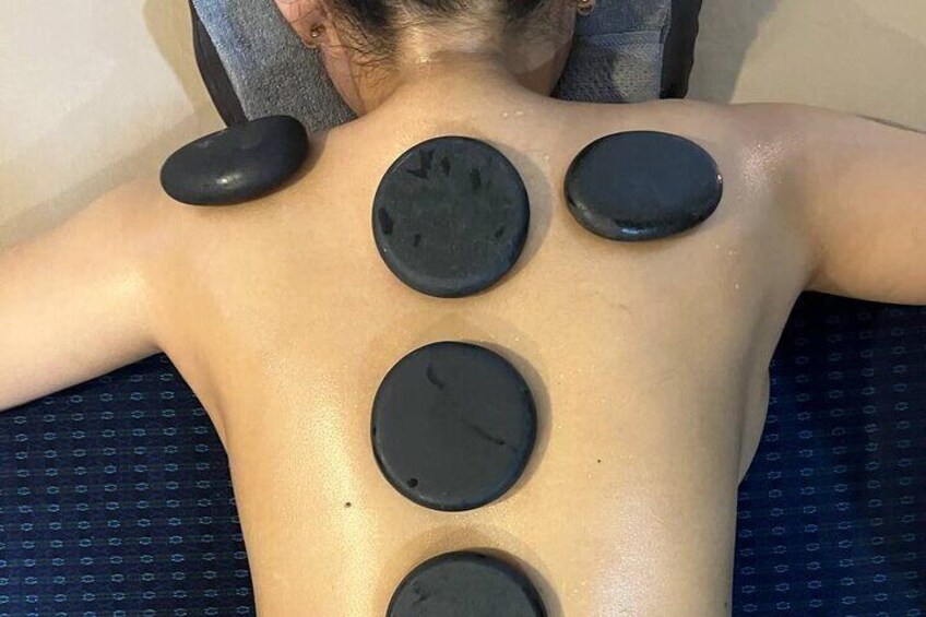 Picture of a customer having Aromatherapy Hot Stone Massage 