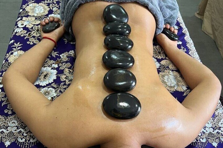 Picture of a customer having Aromatherapy Hot Stone Massage (Female)