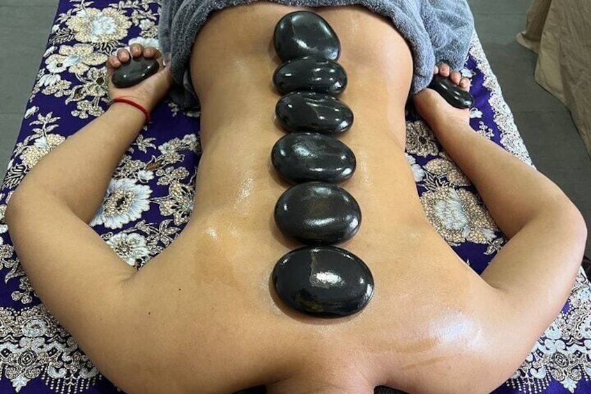 Picture of a customer having Aromatherapy Hot Stone Massage (Female)