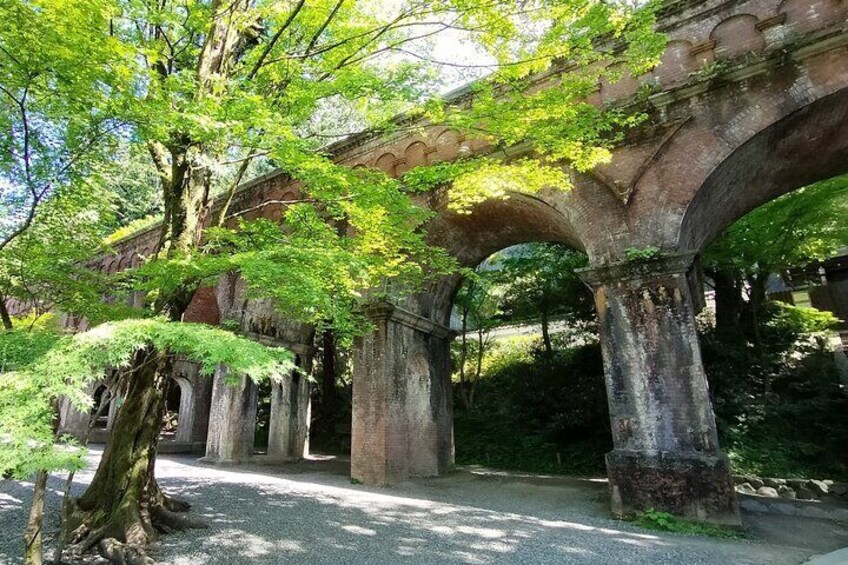 The Nanzen-ji Aqueduct (Suirokaku) is a unique Meiji-era European-style brick waterway that beautifully blends industrial engineering with the historic temple grounds.