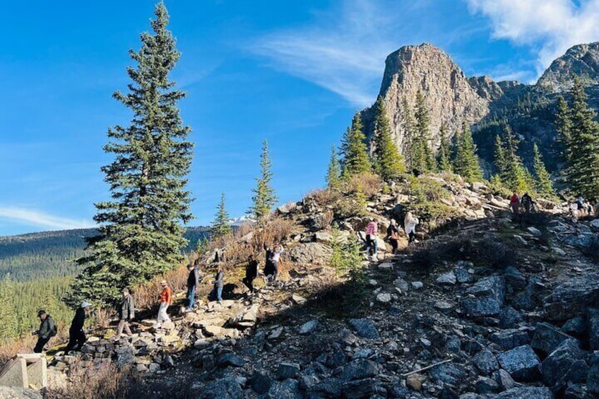 Walk up to the rockpile and take in the lake and the towering Valley of the Ten Peaks.