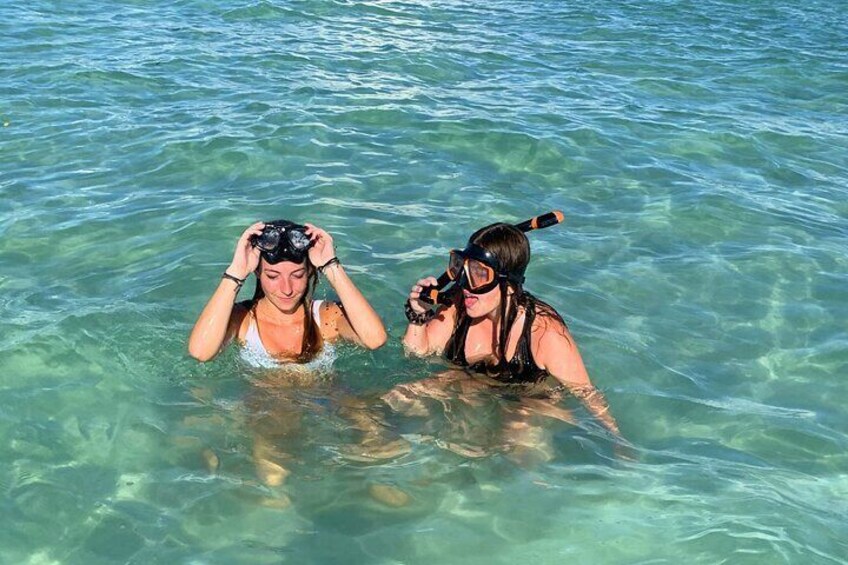 Two girls snorkeling at passage key, florida