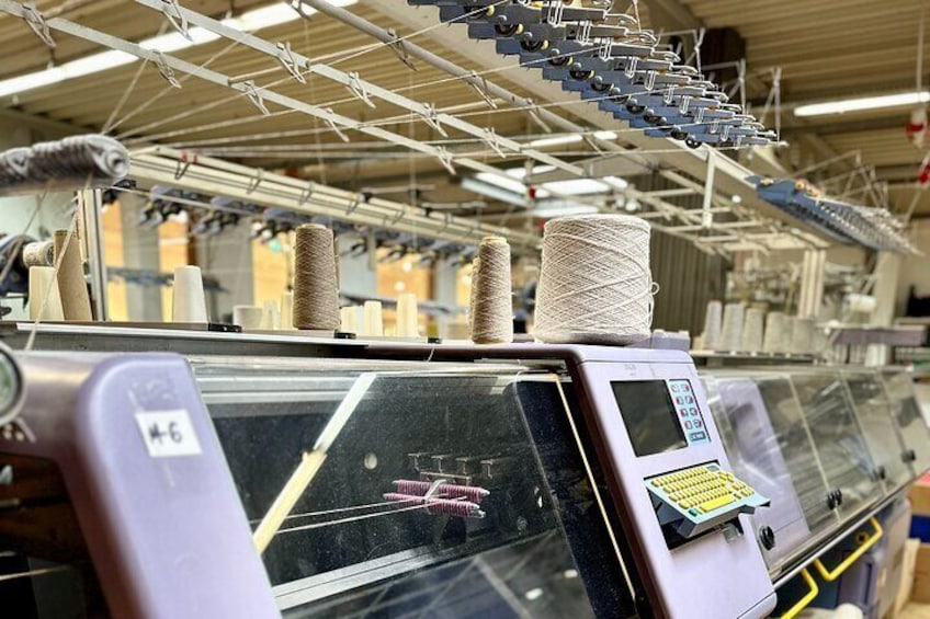 A flat knitting machine up close