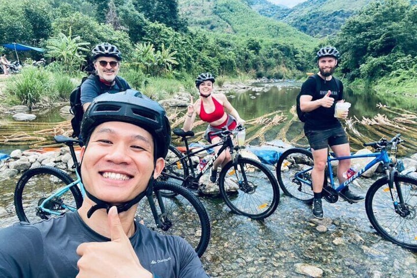 Cycle across a small stream to reach Mơ stream - Da Nang countryside bike tour