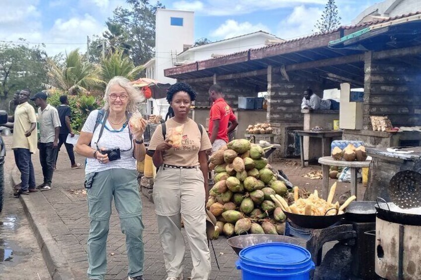 Enjoying cassava crisps and fresh coconut water