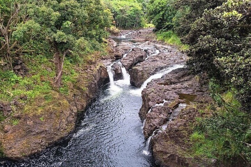 You will see the sluthes waterfalls as I drive slowly over a beautiful old bridge in Hilo!