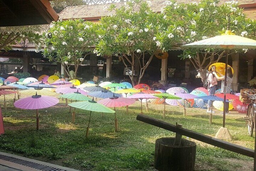 A handcrafted umbrella is one that is made by hand, usually by village artists, and can be adorned with embroidery or other designs.