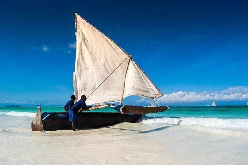 a dhow on pristine white sands, crystal-clear turquoise waters,