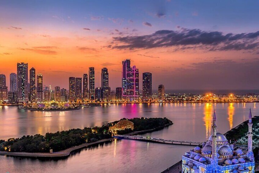 A breathtaking view of Sharjah’s skyline as seen from Al Noor Island at sunset.